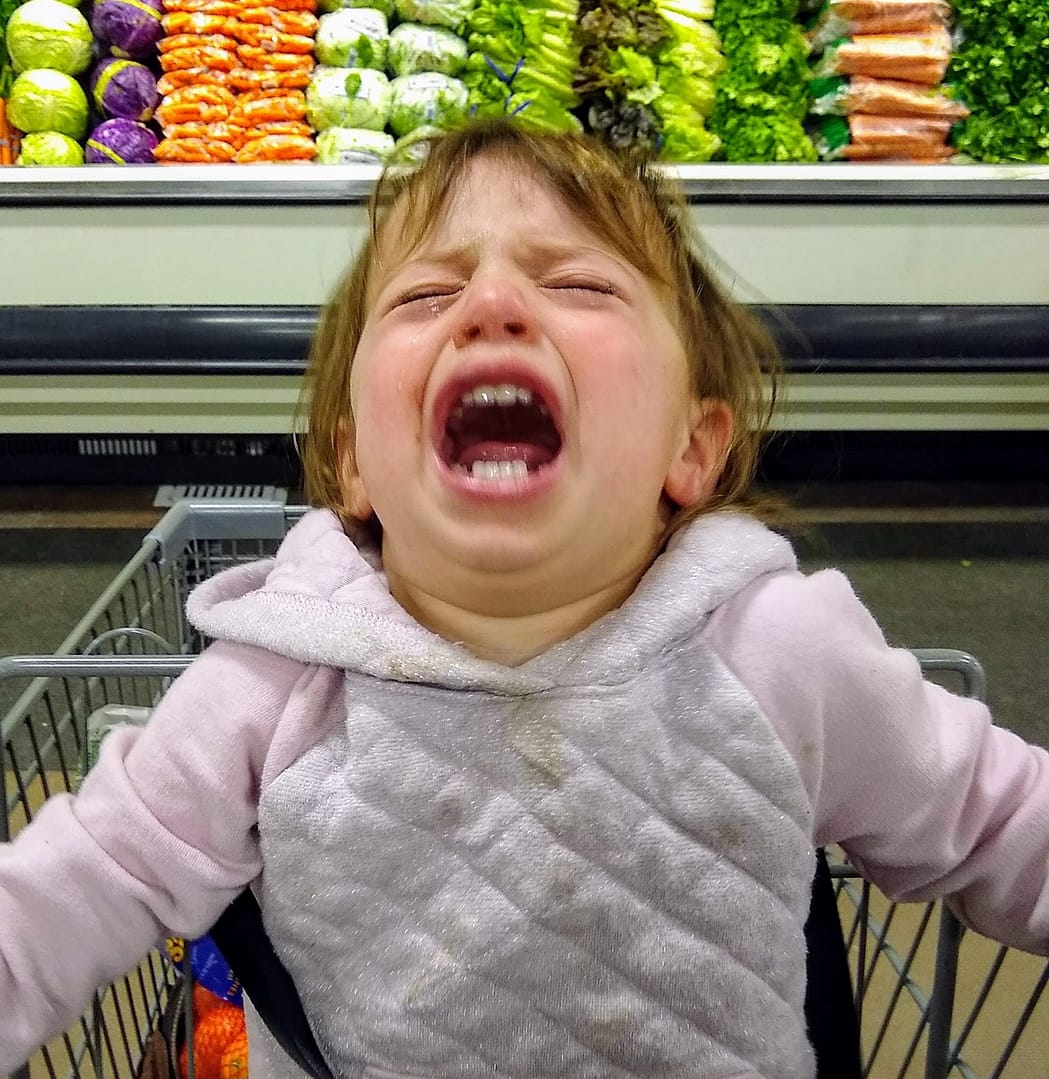 Unhappy baby at the grocery store