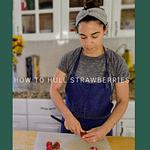 Chef hulling a strawberry