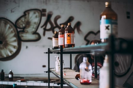 Rows of bottles of poison on a shelf
