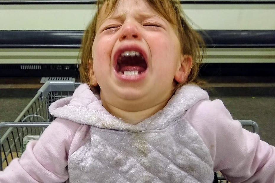 Unhappy baby at the grocery store